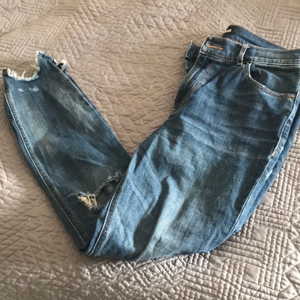 Medium wash distressed frayed hem jeans